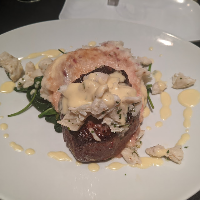 Steak with Crab on Mashed Potatoes with Hollandaise Sauce