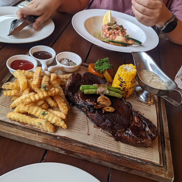 Salmon Tartare Angus Ribeye with Peppercorn Sauce and Parmesean Garlic Fries