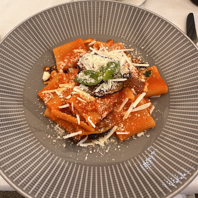Homemade Stracciatella Cheese Agnolotti Served With Heirloom Tomatoes And Basil