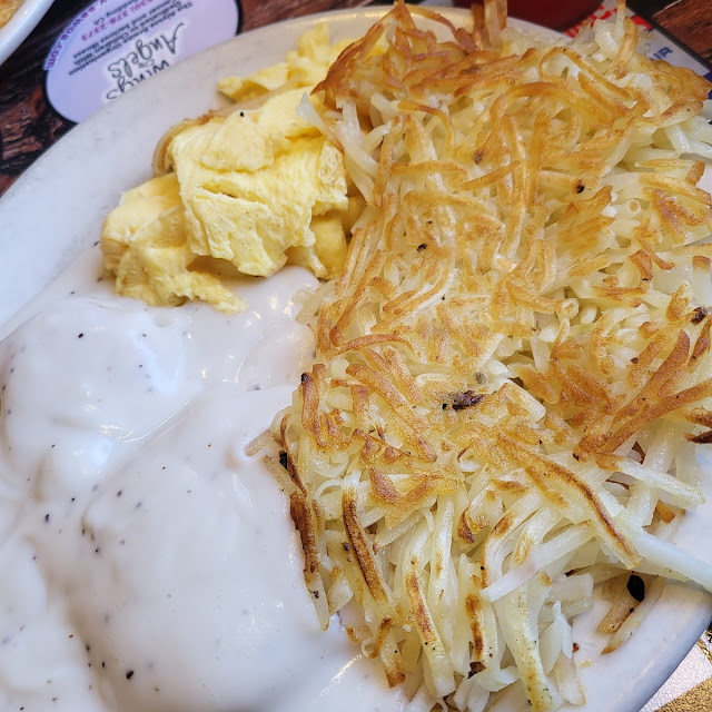 Scrambled Eggs Hash Browns and Biscuits with Vegetarian Gravy