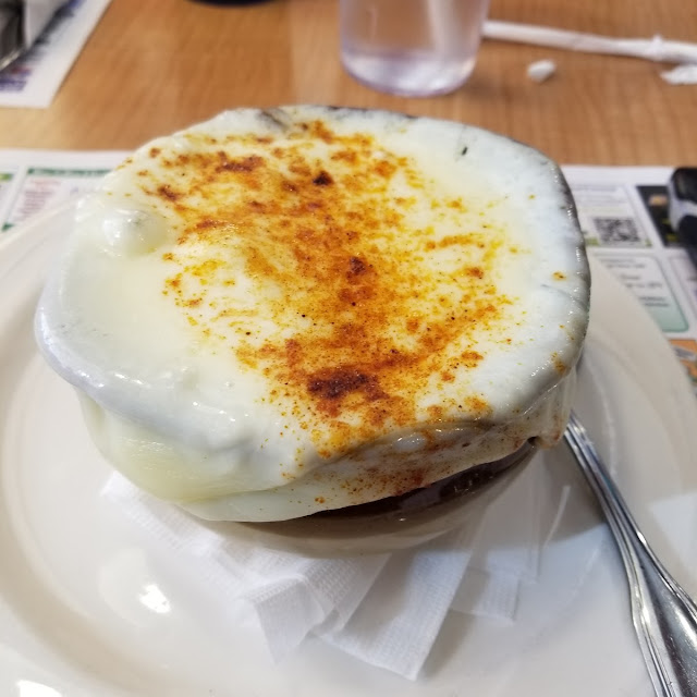 Crock of French Onion Soup with Melted Mozzarella Cheese