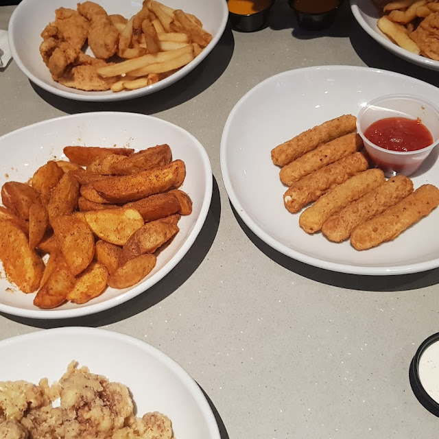 Mozzarella Sticks and Paprika Seasoned Wedges Fries