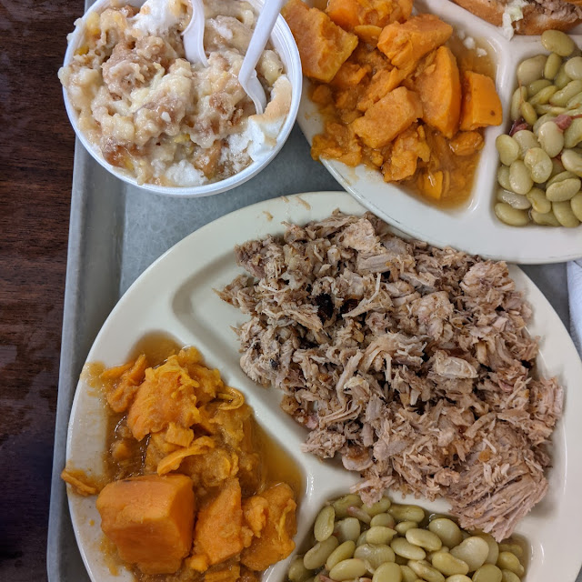 Barbecue Pork Dish Side of Sweet Potatoes Butter Beans Corn Muffin and Banana Pudding