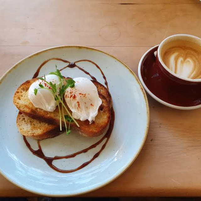 Poached Eggs on Sourdough Bread Baked on Site