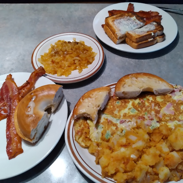 Western Omelette with Home Fries Bacon and a Bagel