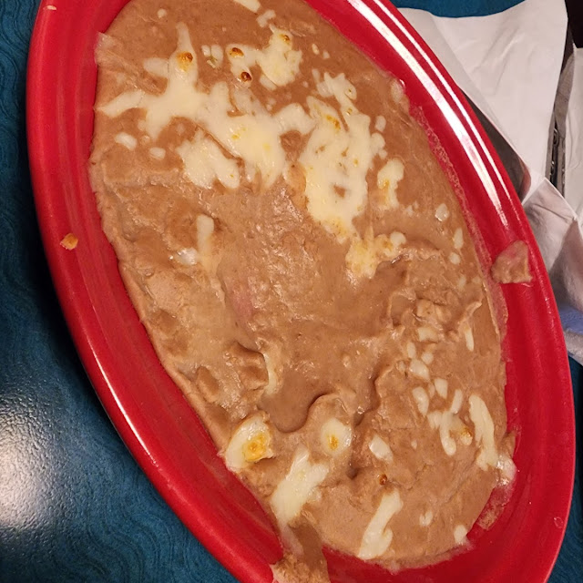One Tostaguac One Enchilada & Beans