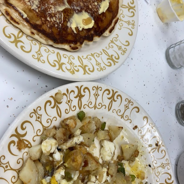 Pancake with American Fries Sunny Side Up Eggs Green Peppers and Onions