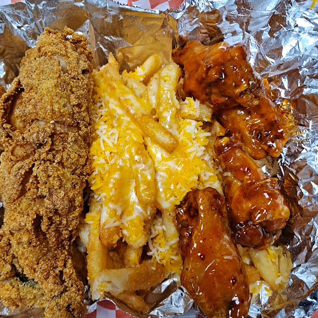 Fish and Chicken Combo with Cheese on the Fries