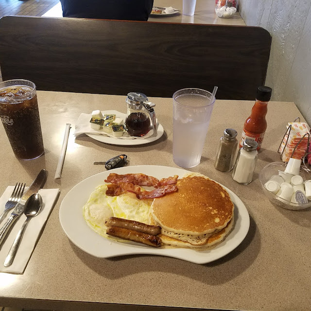 Eggs over Easy Bacon and Sausage with Pancakes