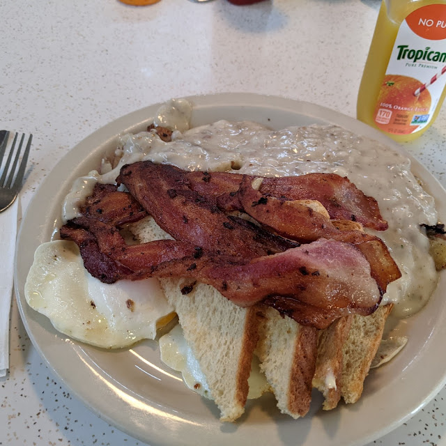 Eggs over Sausage Gravy over Home Fries Bacon