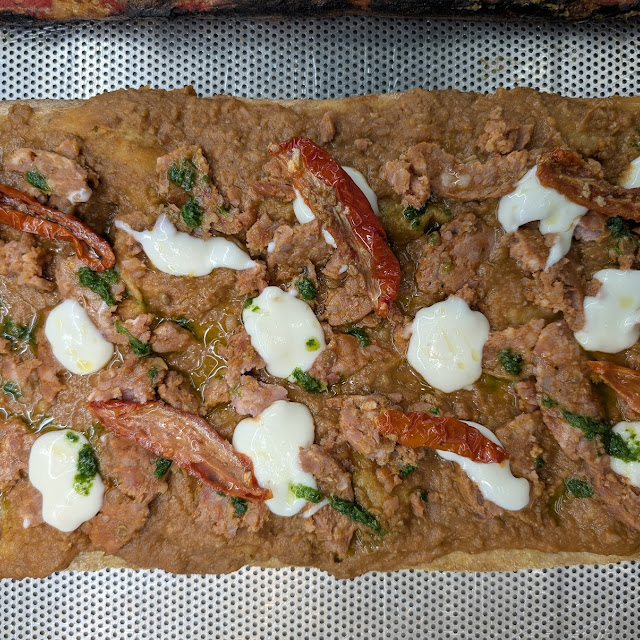 Crema Di Lenticchie Cotechino Cecchini Fonduta Di Grana Pomodori Secchi E Salsa Verde