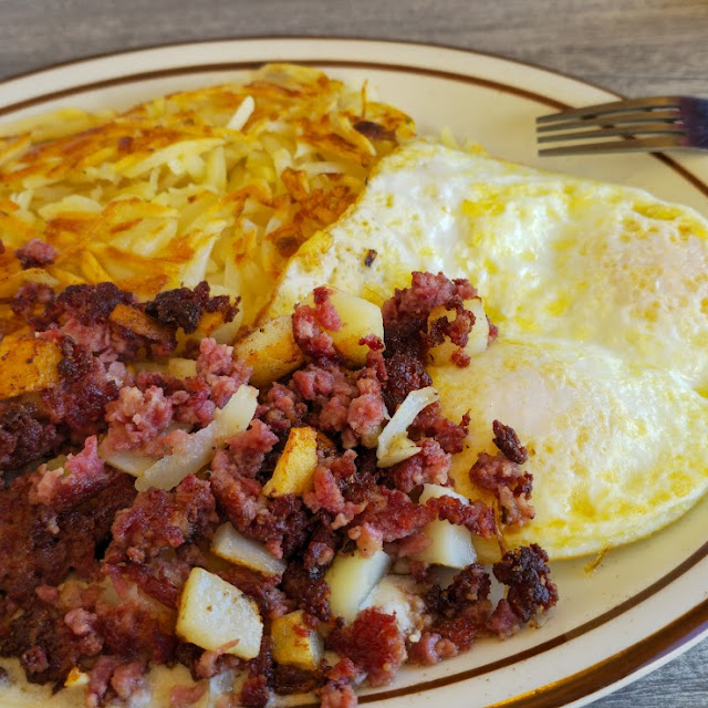 Corned Beef Hash with over Medium Eggs and Hash Browns