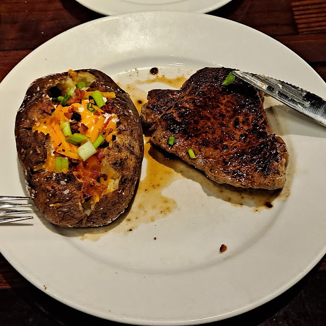 Outlaw Ribeye w Loaded Baked Potato Cooked Medium Rare