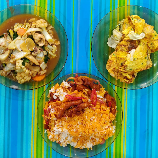 Take-Away Meal of Pork Chop Rice Fried Eggs with Prawns and Stir Fried Mixed Vegetables