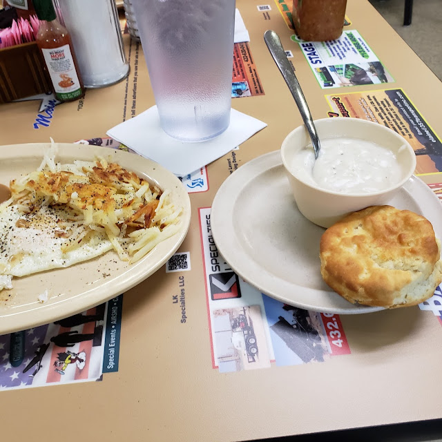 Fried Eggs Hashbrowns with a Biscuit and Side of Gravy