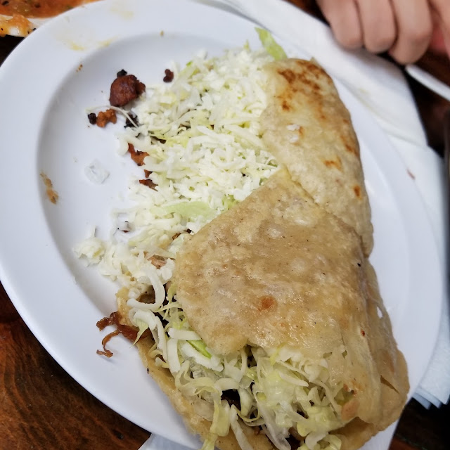 Gorditaa of Chicharron on Green Salsa