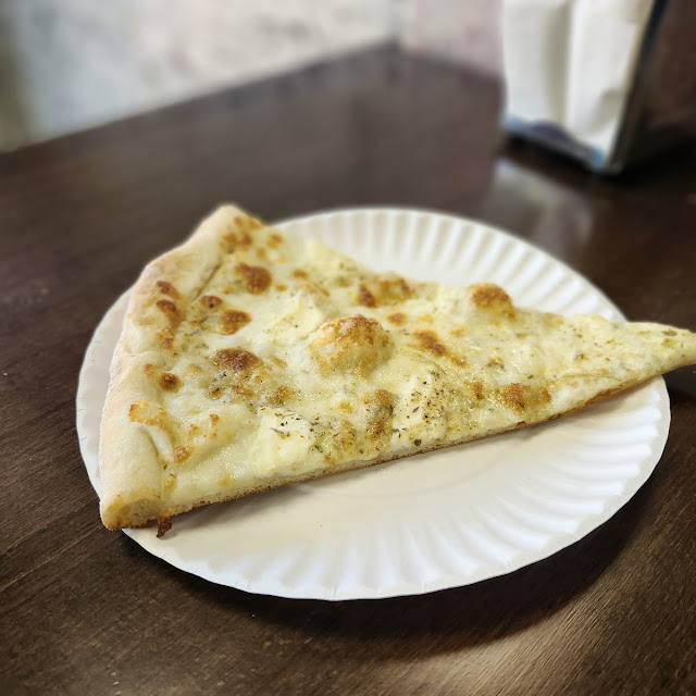 White Four Cheese Pizza Slice