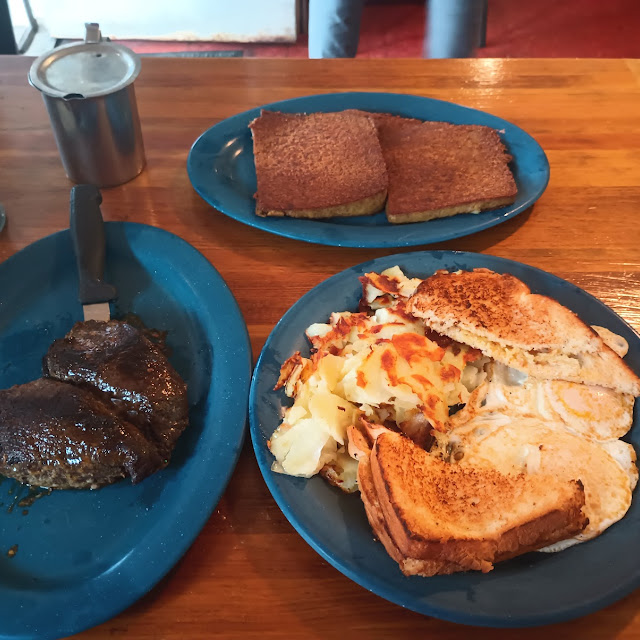 Steak over Easy Eggs Toast and Home Fries