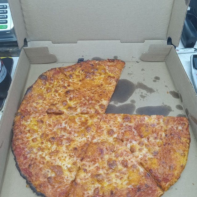 Corrugated Cardboard Topped with Generic Pizza Sauce and Smothered with Old Cheese