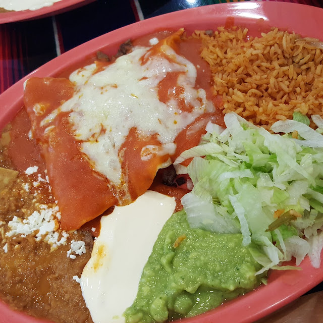 One Enchilada and 1 Sope Combo Plate
