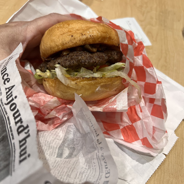 1 3 lb Burger on a Toasted Gluten Free Bun with Mushrooms and Grilled Onion Plus Lettuce and Tomato