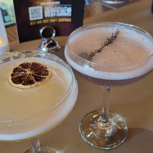 On the Left a Tuaca Lemon Drop with Tuaca Brandy on the Right a Juniper and Lafleur