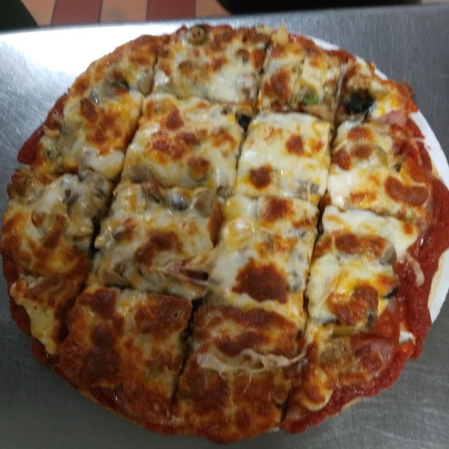 Pizza from the Village Bar and Grill
