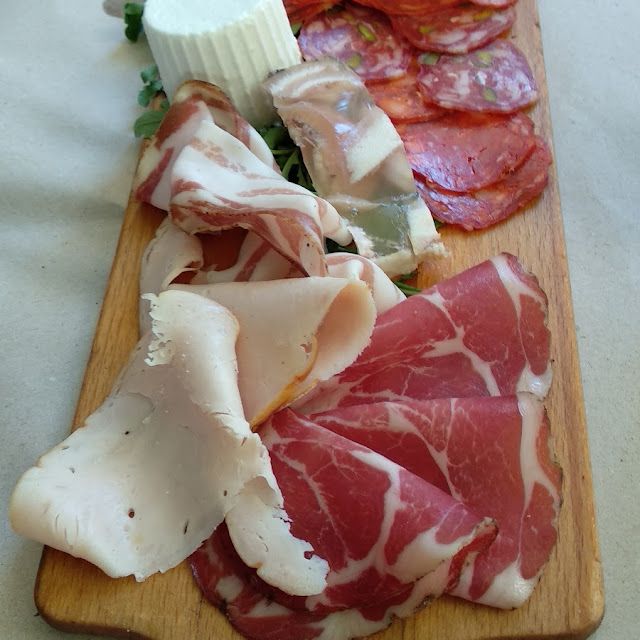 Cutting Board of Meats and Cheeses