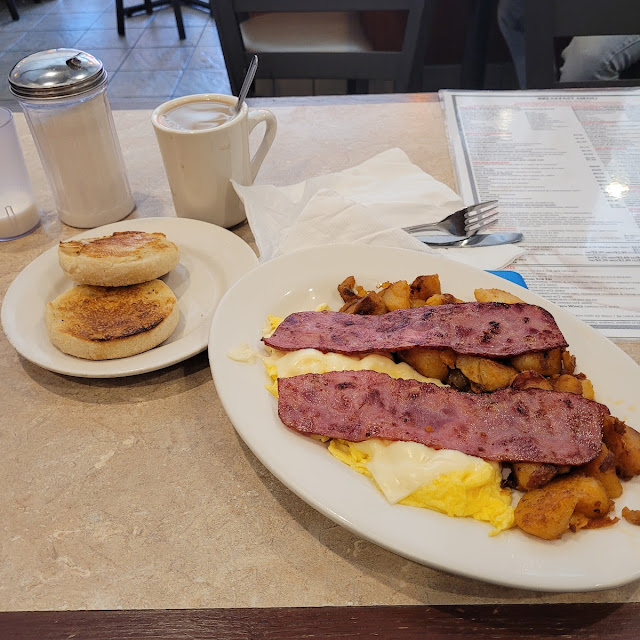 Scrambled Eggs with Cheese Turkey Bacon and an English Muffin