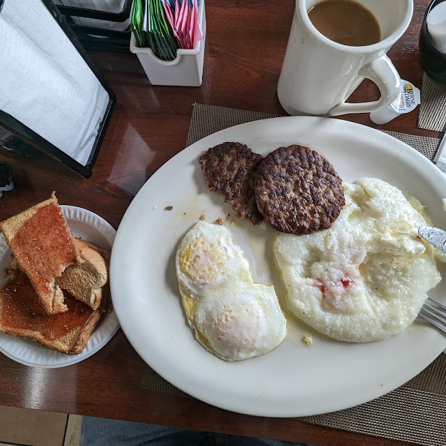Over Medium Sausage Grits Wheat Toast and Grape Jelly